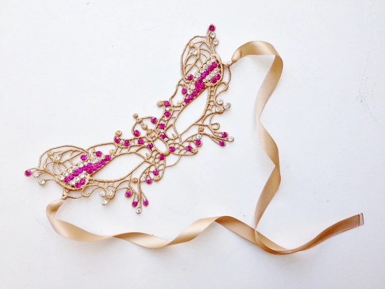 Gold lace masquerade mask available plain or with sparkling rhinestone accents.