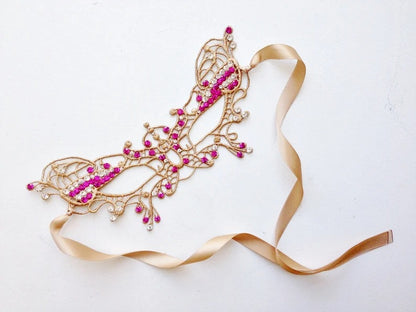 Gold lace masquerade mask available plain or with sparkling rhinestone accents.