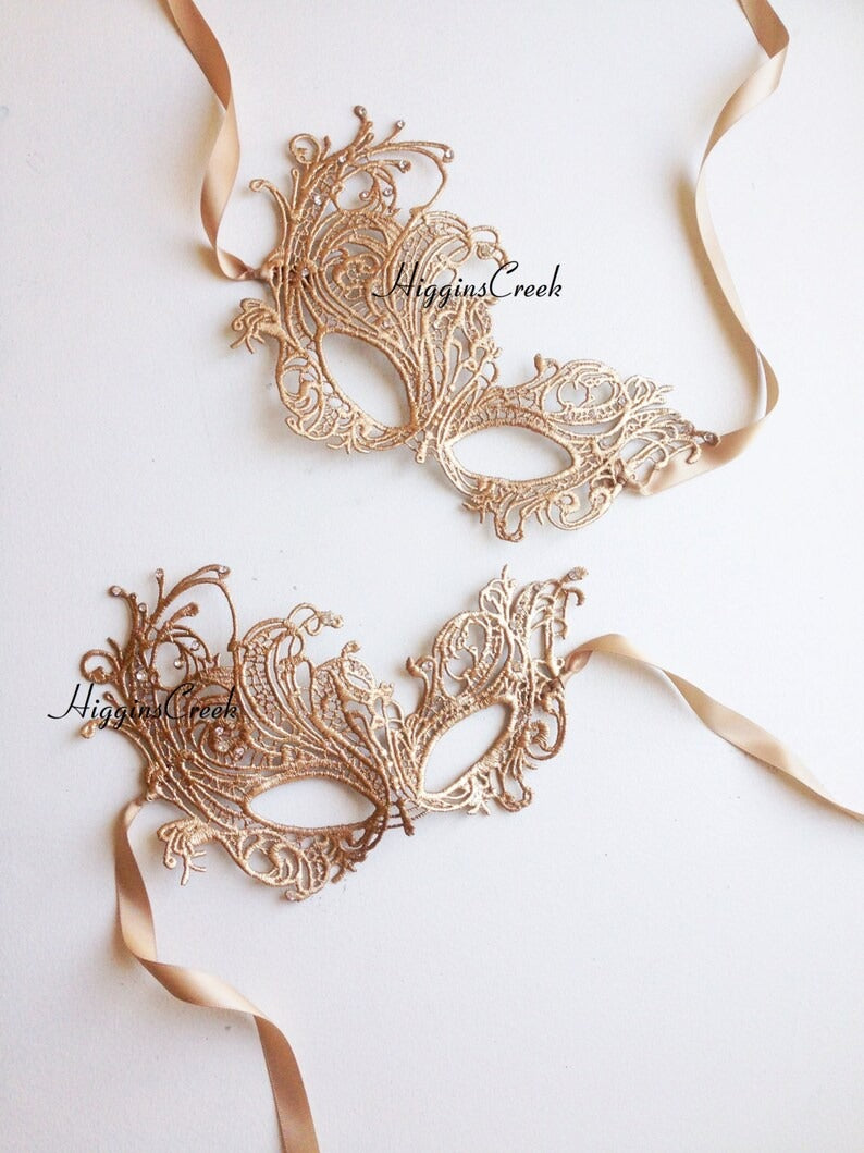 Gold lace masquerade mask with satin ribbons for women, ideal for Venetian balls, weddings, and costume parties.