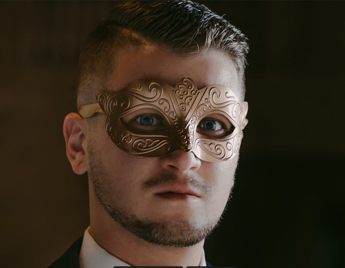 Men’s gold masquerade mask with embossed baroque metal detailing for formal events.