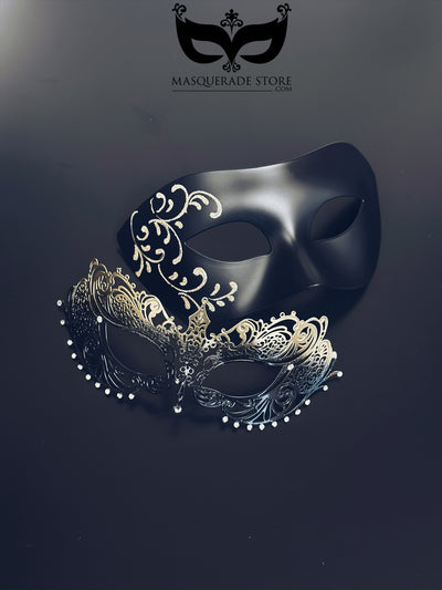Black and gold couples masquerade masks with matte black mask with filigree detailing for men and gold ombre laser-cut metal mask for women.