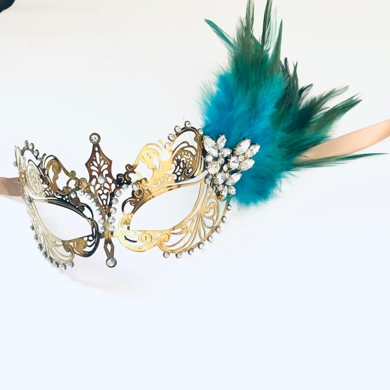 Elegant gold masquerade mask with teal feathers and rhinestones, Venetian style costume mask for women.