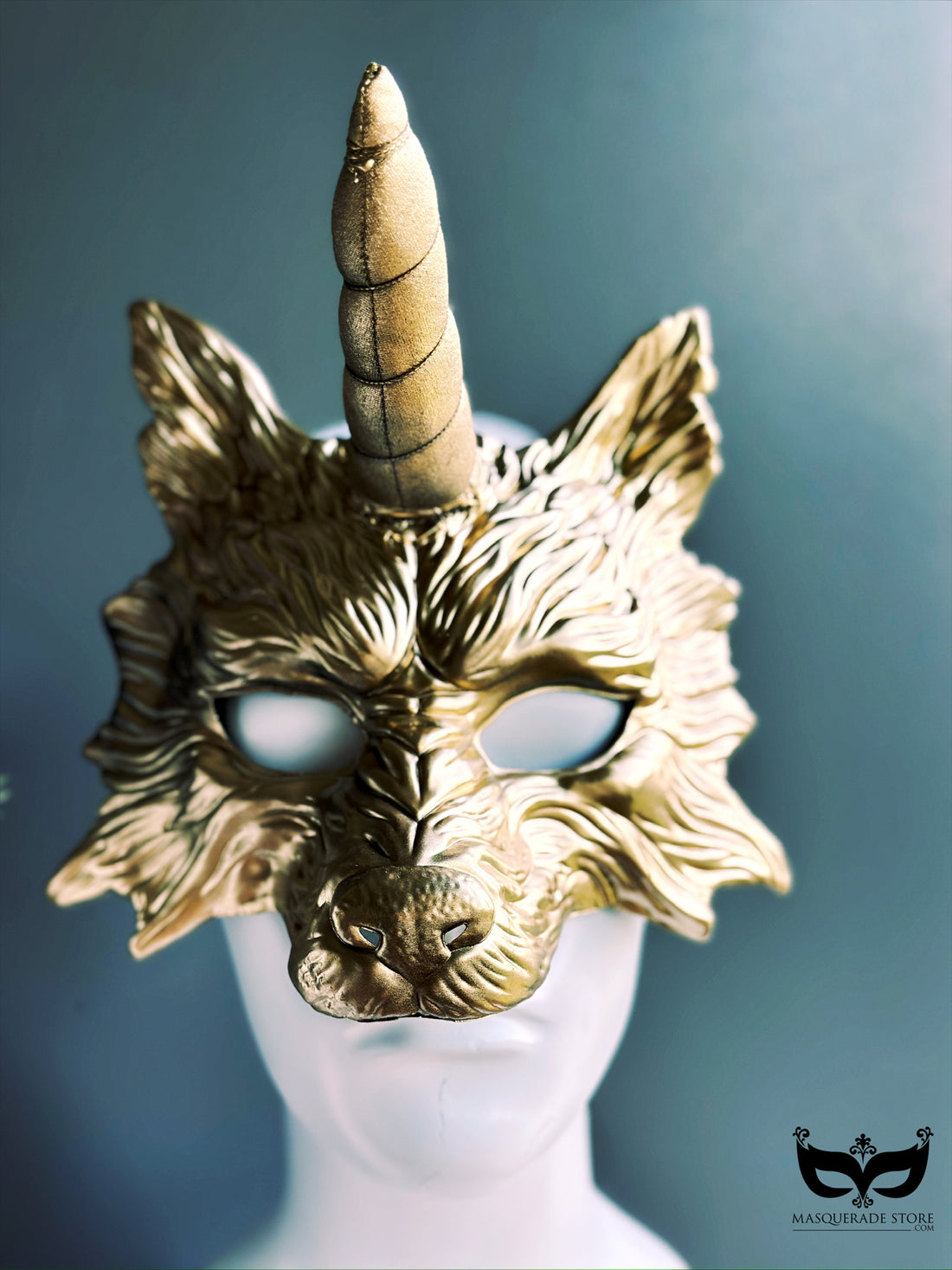 Metallic gold masquerade mask with sculpted wolf details and a plush unicorn horn for Halloween or fantasy cosplay