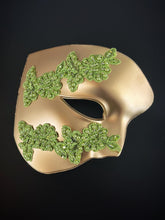 Green and gold half-face masquerade mask with lace detail for men’s masquerade events and Mardi Gras

