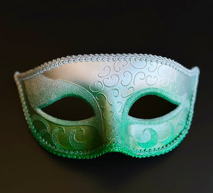 Mens green and silver ombre Venetian masquerade mask featuring embossed Baroque scrollwork, metallic finish, braided trim, and a classic eye mask silhouette for masquerade balls and formal occasions.