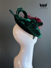 Elegant red rose headpiece on green velvet base.