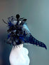 Blue faux leather plague mask with black and blue feathers, perfect for Halloween or gothic masquerades.