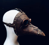 Handcrafted brown faux leather plague mask with antique rivets and vintage goggles, perfect for Halloween or steampunk events.