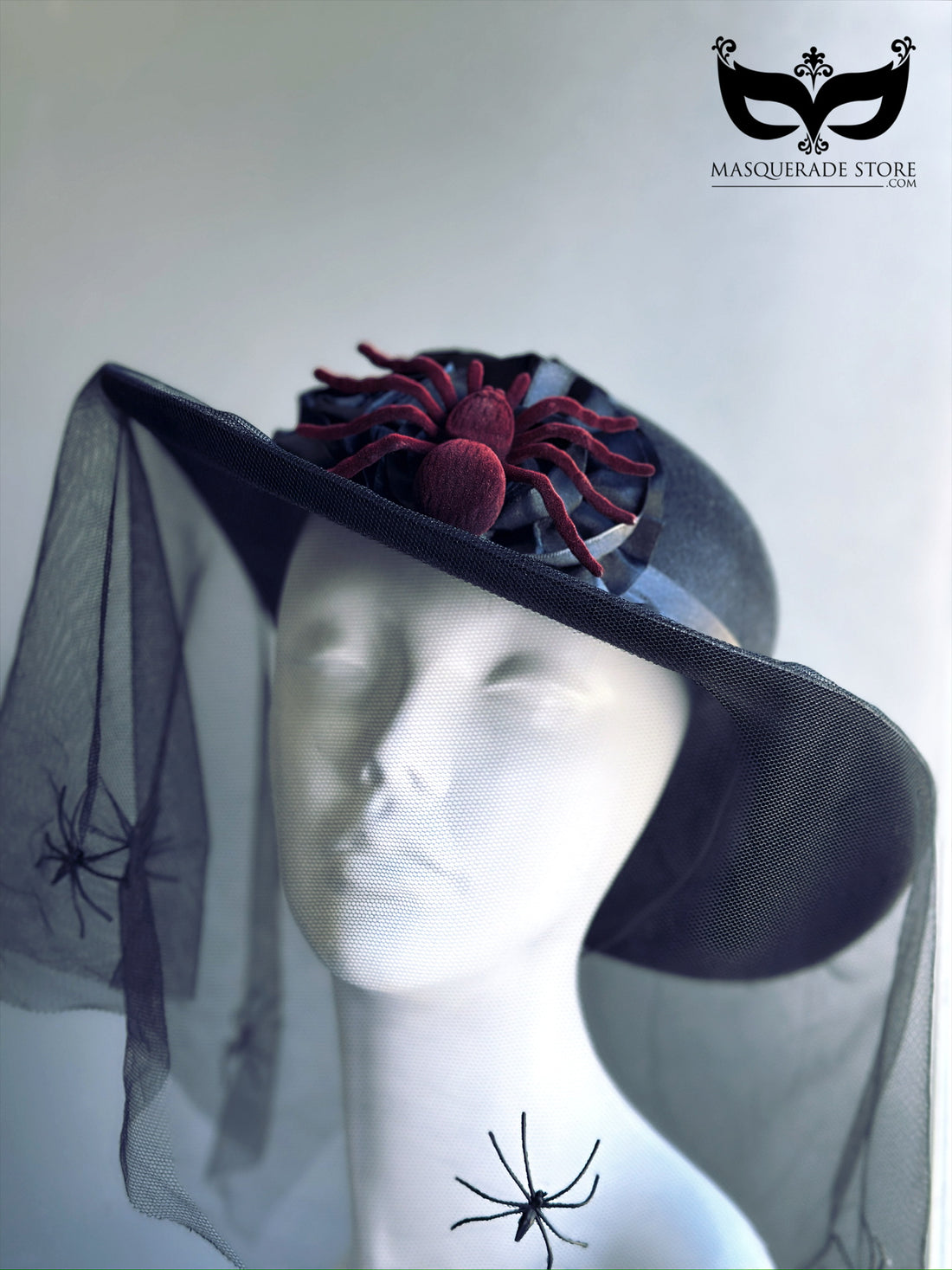 Black Halloween veil hat with red spider topper and mesh veil with crawling spider details, perfect for witches and gothic costumes.