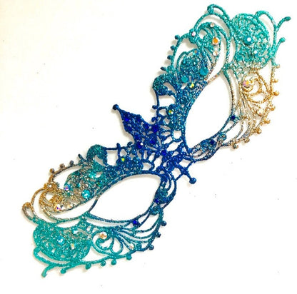 Venetian handheld masquerade mask with peacock feathers, jeweled details, and blue feather plumes.
