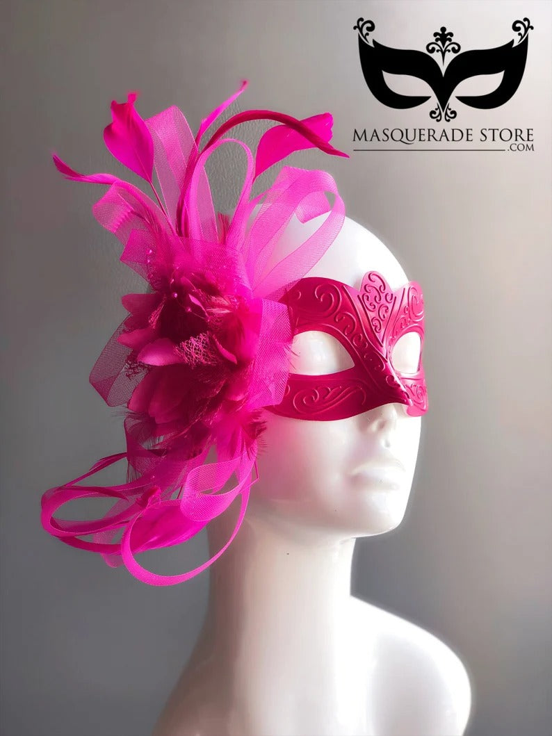 Hot pink Venetian masquerade mask with feather and tulle plume accent.