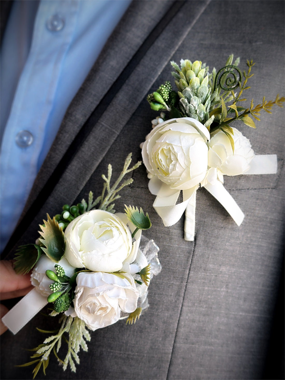 Ivory rose prom boutonniere and corsage set with silk flowers and greenery.
