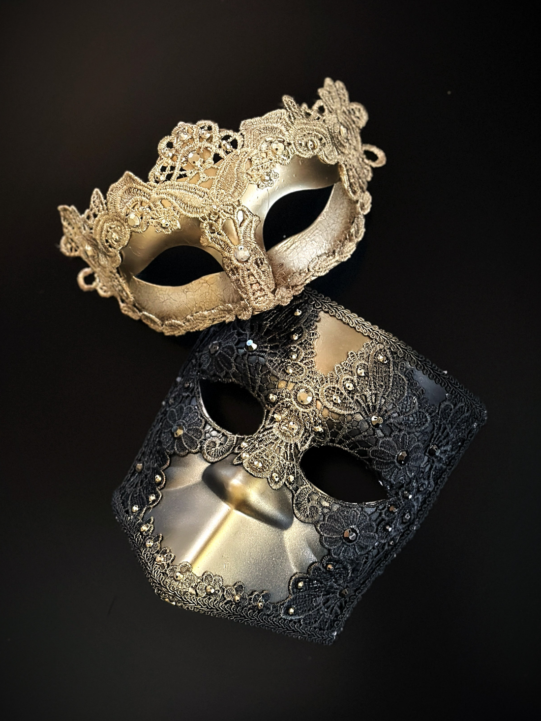 Venetian couples mask set with a gold lace filigree mask and black lace Bauta mask for formal masquerade events.