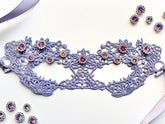 Lavender embroidered lace Venetian masquerade eye mask featuring amethyst crystal rhinestones and satin ribbon ties. Perfect for masquerade balls, Mardi Gras celebrations, weddings, bridal showers, black tie galas, Renaissance festivals, opera performances, cosplay, Valentine&