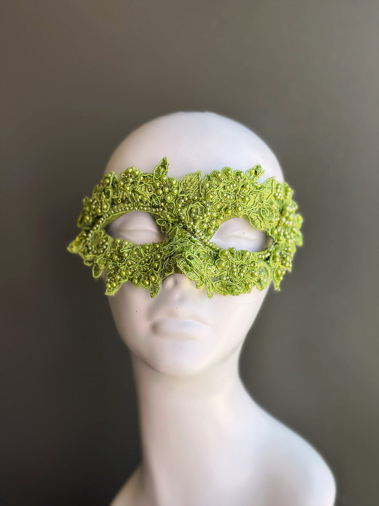 Lime green lace masquerade mask with floral embroidery, bead embellishments, and botanical-inspired Venetian eye-mask detailing