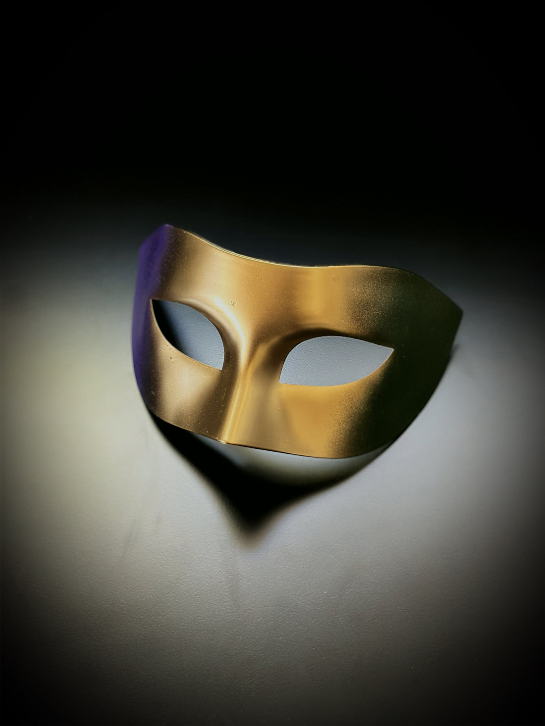 Mardi Gras ombre mask featuring gold in the center with one green side and one purple side, perfect for carnival and masquerade events.