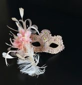 Blush pink and gold lace masquerade mask with feathers and crystals for weddings, galas, and formal masquerade occasions.