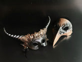 Gothic Halloween couples mask set with horned floral mask and plague doctor beak mask.
