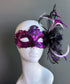 Purple lace masquerade mask with crystal embellishments and black detail styled for masquerade balls and formal events.