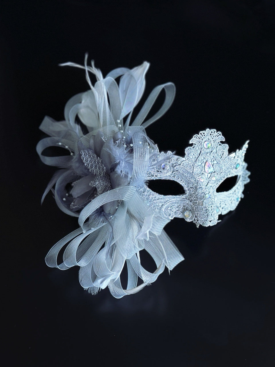 Silver lace masquerade mask with feather and crystal detail for weddings, galas, and formal masquerade events.
