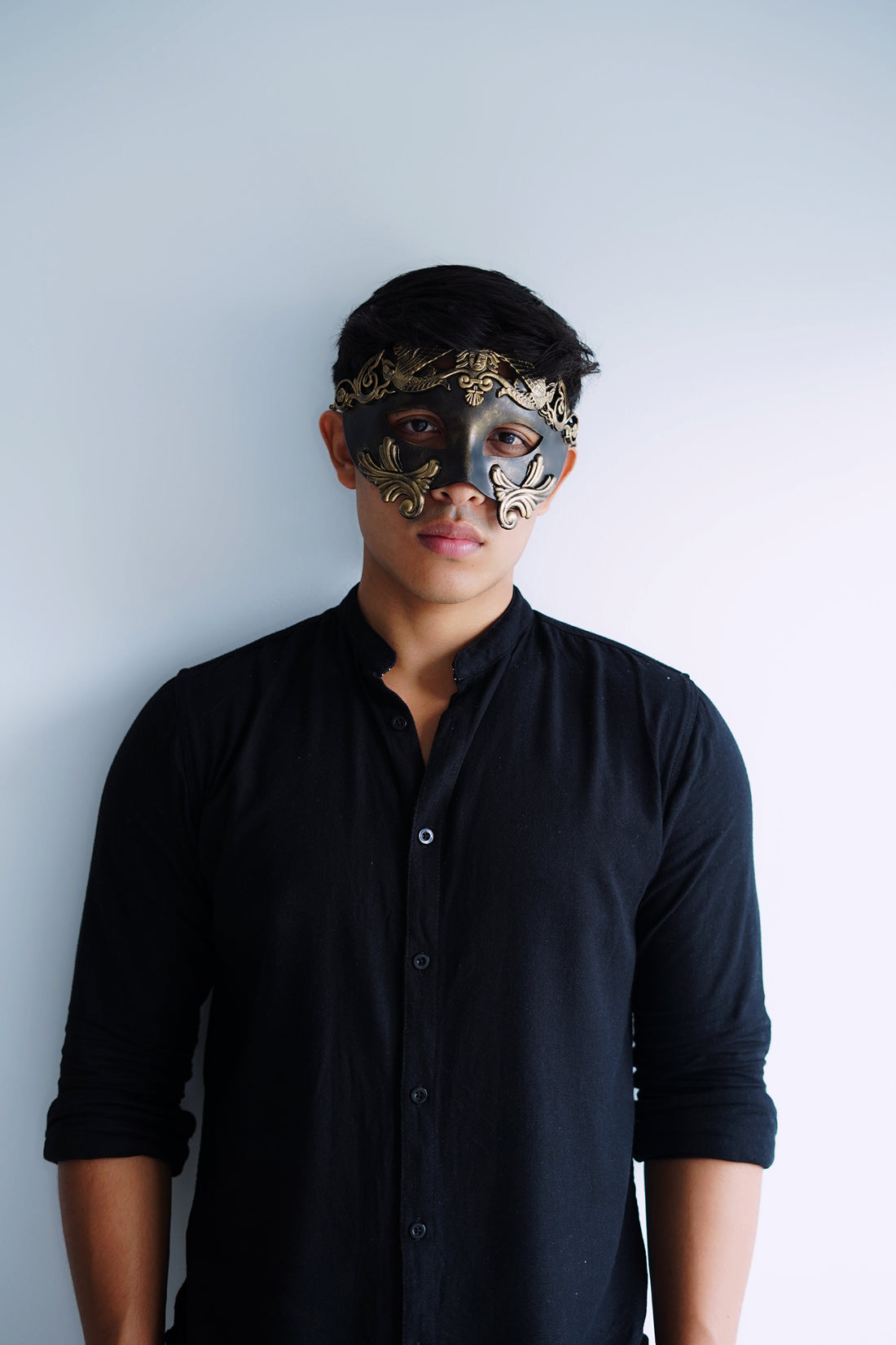 Classic men’s black gold mask for masquerade and formal occasions.