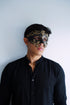 Men’s black and gold masquerade mask with filigree baroque design.