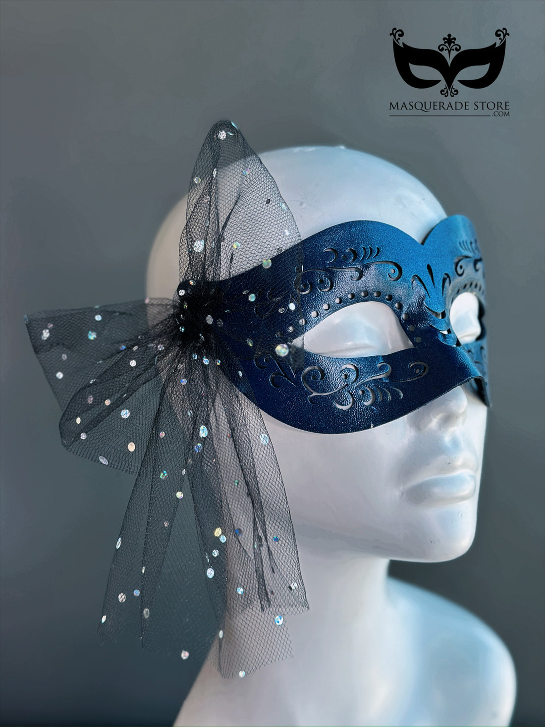 Black masquerade mask with scroll accents and rhinestone tulle bow for prom or party wear