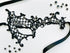 Black embroidered spiderweb lace masquerade mask with sparkling black rhinestones and satin ribbon ties. Perfect for Halloween, gothic costumes, masquerade balls, vampire cosplay, Venetian masquerade events, Mardi Gras celebrations, theatrical performances, gothic weddings, fantasy costumes, and elegant evening wear.