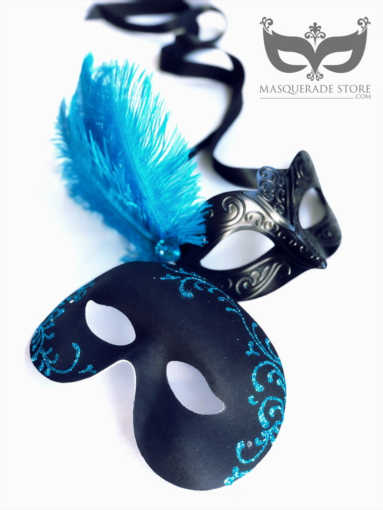 Elegant black Venetian mask with a vibrant blue feather and gemstone accent, and a mens mask with matching blue filigree, perfect for masquerade events and costume parties.