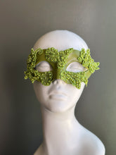 Handcrafted olive green floral lace masquerade mask featuring embroidered lace appliqués and decorative beadwork on a satin base, designed for Venetian masquerade balls, Mardi Gras, cosplay, weddings, galas, and elegant costume events.