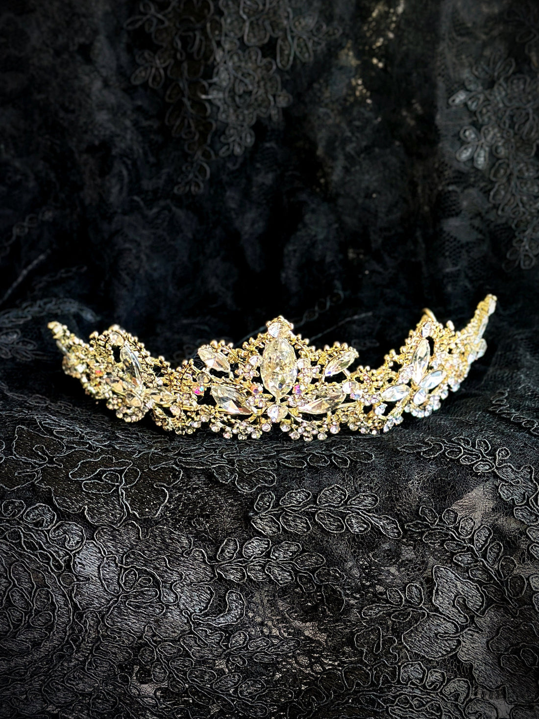Gold floral crown with opal-like crystals and sparkling rhinestones.