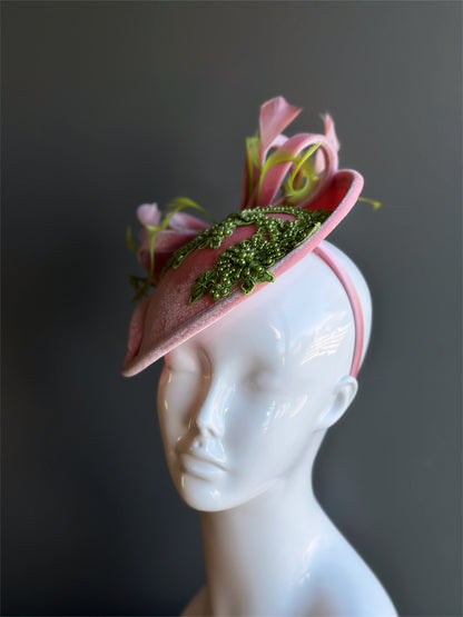 Velvet tea party fascinator hat with green beaded accents.