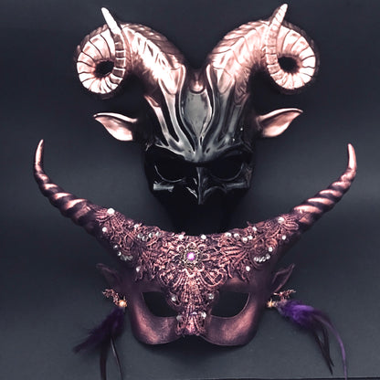 Purple and black gothic couples masquerade masks with ram horns and lace.