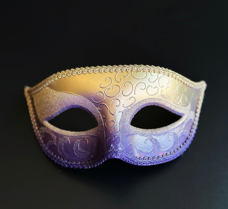 Mens purple and gold ombre Venetian masquerade mask featuring embossed Baroque scrollwork, metallic finish, braided trim, and classic eye mask silhouette for formal masquerade events.