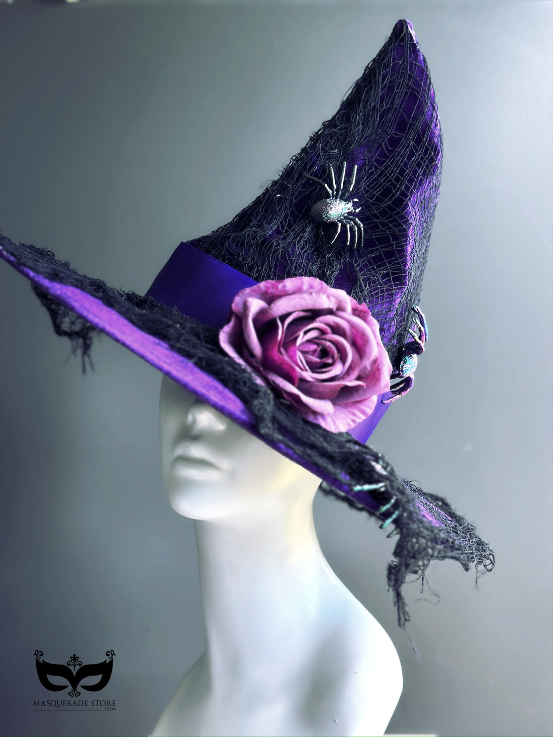 Purple witch hat with pink rose, spider accent, and black web mesh, ideal for Halloween costumes or gothic cosplay