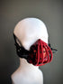 Red and black steampunk respirator mask with gears, tubing, and mechanical details, perfect for cosplay, gothic, and cyberpunk fashion.

