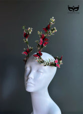 Red butterfly antler headpiece with moss greenery and monarch style wings for fantasy costumes and masquerade events