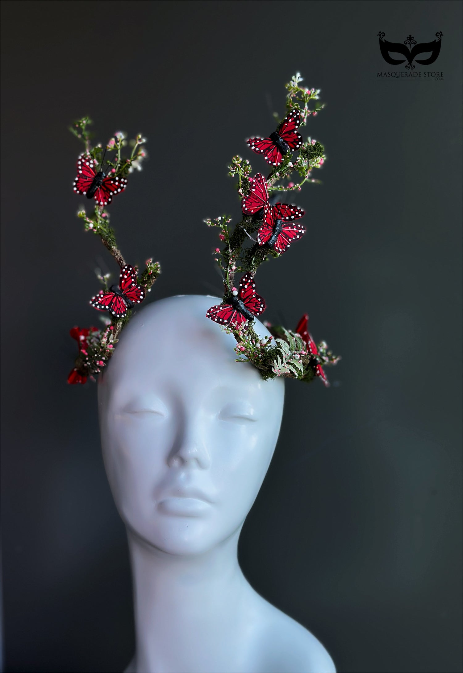Red butterfly antler headpiece with moss greenery and monarch style wings for fantasy costumes and masquerade events