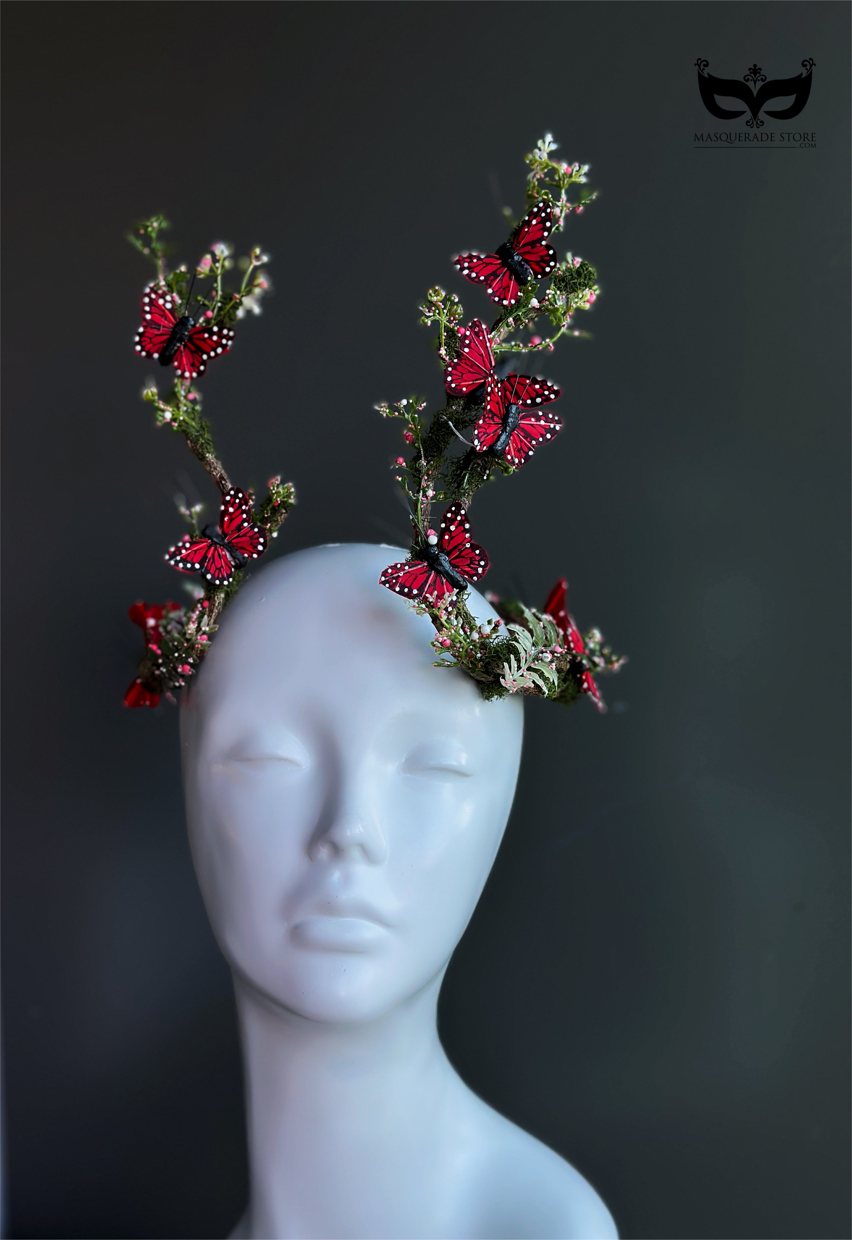 Red butterfly antler headpiece with moss greenery and monarch style wings for fantasy costumes and masquerade events