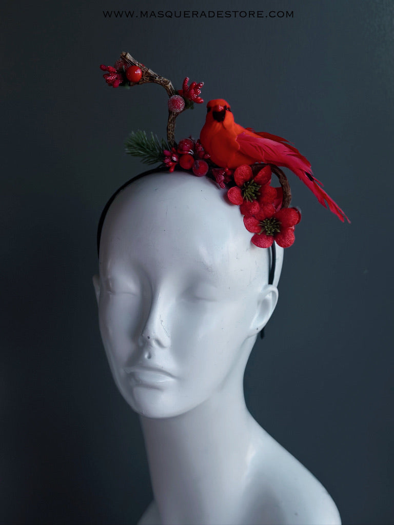 Red cardinal bird headband with red berries, flowers, and greenery on a black band.