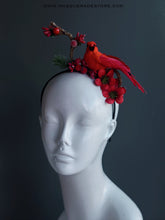 Red cardinal bird headband with red berries, flowers, and greenery on a black band.