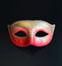 Red and gold ombre Venetian masquerade mask with embossed Baroque scrollwork, glitter eye detailing, and classic Phantom-inspired silhouette