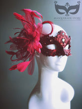 Elegant red lace mask with feathers, rhinestones, and ribbons for Valentine’s, masquerade balls, and prom.