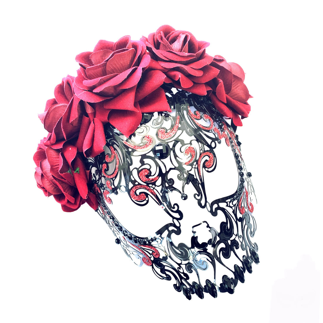 Black metal skull mask adorned with red roses and rhinestones, ideal for Day of the Dead, Halloween, and gothic celebrations.