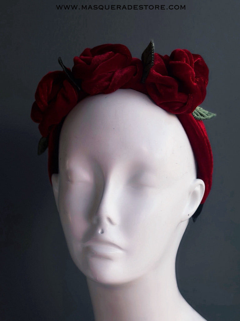 Red velvet floral headband with large fabric roses on a velvet band.