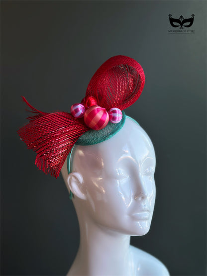 Red bow holiday fascinator headband with mesh loops and ornament bead accents on mannequin