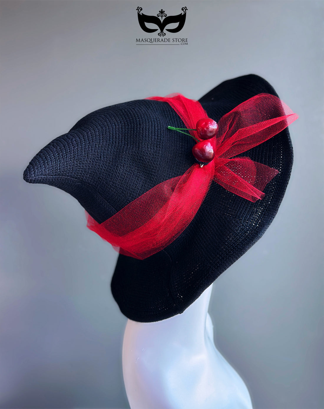 Retro black witch hat with red bow and cherry accents, inspired by 1950s vintage fashion and Halloween style