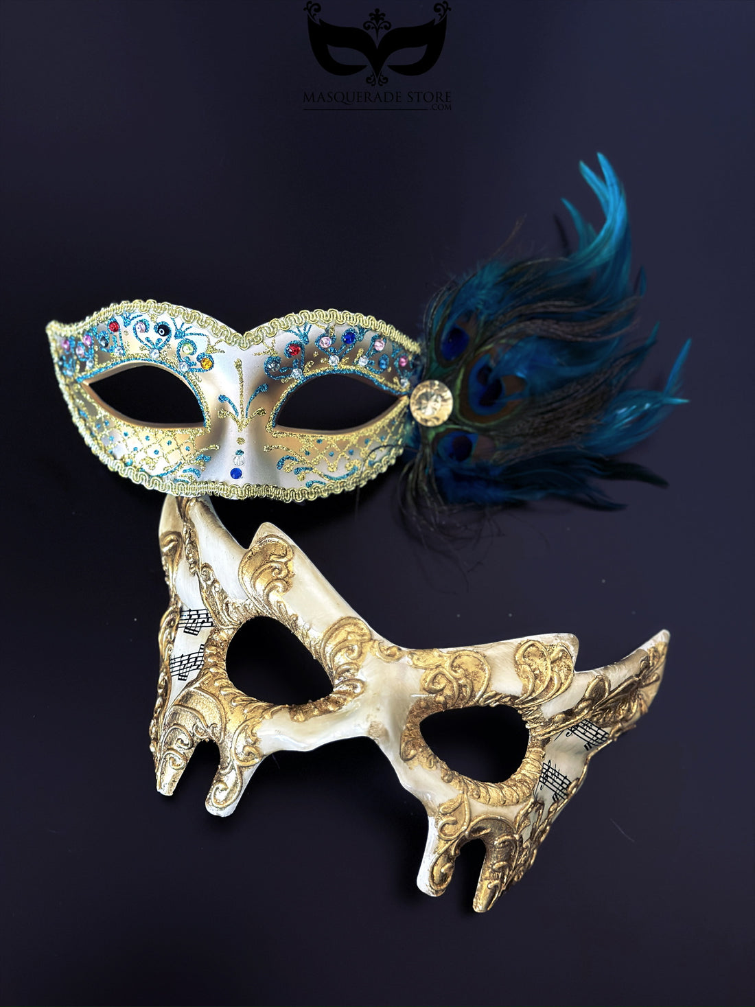 Gold baroque music scroll mask paired with a jeweled peacock feather mask as an elegant masquerade set for couples