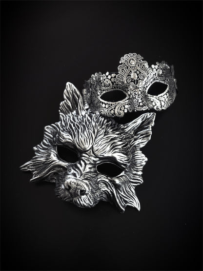 Silver wolf and lace couples masquerade masks on black background