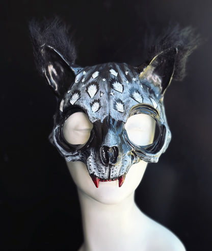 Gray and black Catwoman masquerade mask with faux fur ears, oversized feline eye openings, realistic sculpted details, and red fangs. Perfect for Catwoman facemask searches, masquerade mask cat like costumes, Halloween masks for women, adult masquerade masks for men and women, gothic cosplay, Witcher-inspired costumes, couples costume masquerade looks, black cat woman costumes, midnight masquerade masks, and fantasy animal cosplay.
